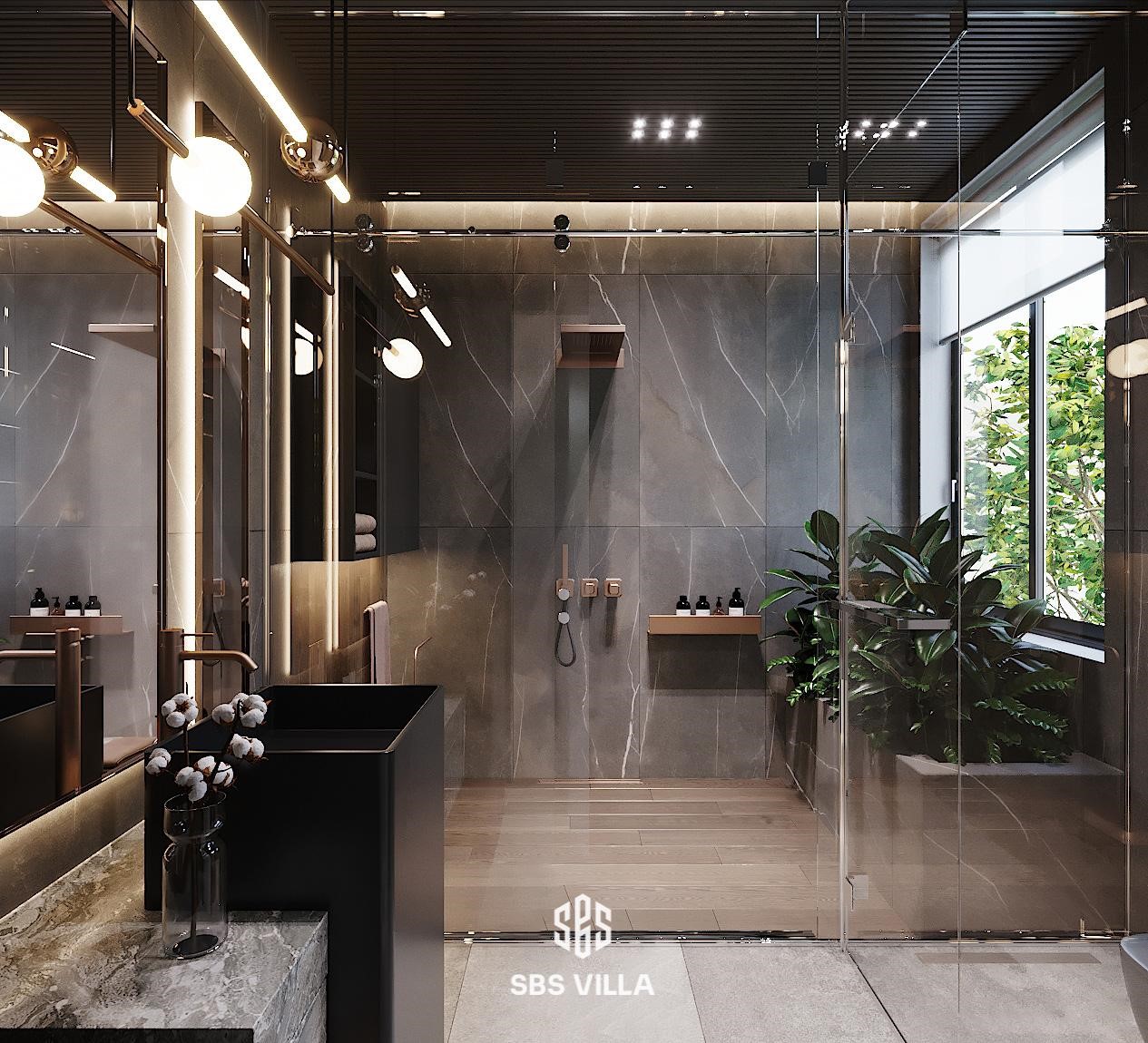 Thiết kế khu vực phòng tắm mang phong cách hiện đại nổi bật với lối kiến trúc không gian mở, kết nối trực tiếp với thiên nhiên xanh mát. Bên cạnh đó, thiết kế sử dụng gam màu tối chủ đạo, tạo điểm nhấn cùng hệ thống đèn ánh vàng sang trọng tạo nên một tổng thể hài hòa và không gian sinh hoạt đầy lý tưởng ngay tại gia